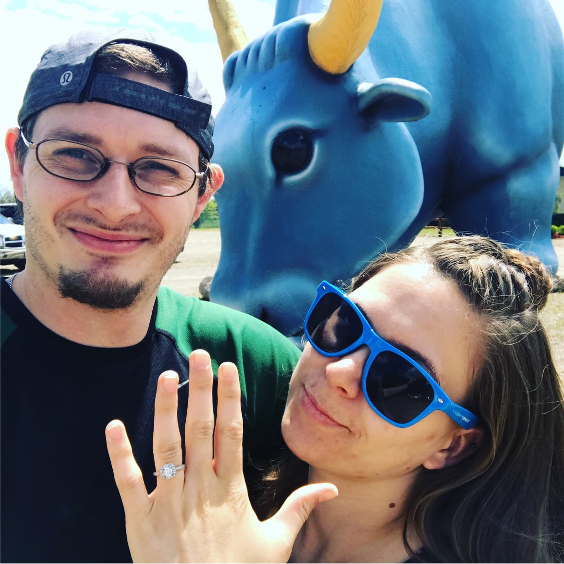 Image of man and woman in front of Babe the Blue Ox statue.